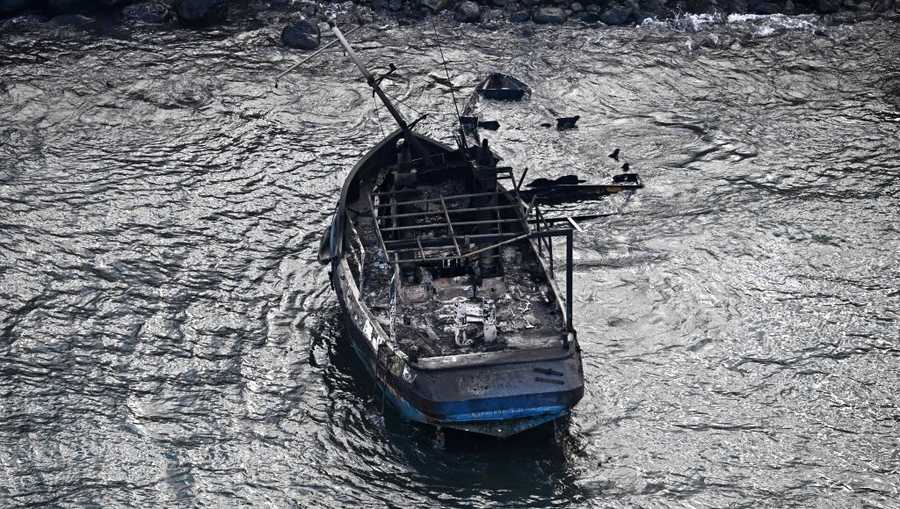US-FIRE-HAWAII An aerial image taken on August 10, 2023 shows a burned boat in the Lahaina Harbor in the aftermath of wildfires in western Maui, Hawaii. At least 36 people have died after a fast-moving wildfire turned Lahaina to ashes, officials said August 9, 2023 as visitors asked to leave the island of Maui found themselves stranded at the airport. The fires began burning early August 8, scorching thousands of acres and putting homes, businesses and 35,000 lives at risk on Maui, the Hawaii Emergency Management Agency said in a statement. (Photo by Patrick T. Fallon / AFP) (Photo by PATRICK T. FALLON/AFP via Getty Images)