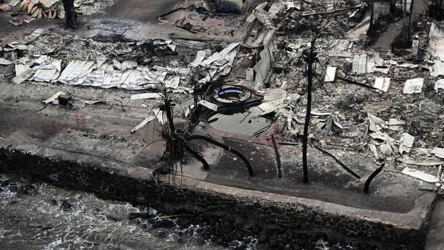 US-FIRE-HAWAII An aerial image taken on August 10, 2023 shows destroyed homes and buildings burned to the ground in Lahaina in the aftermath of wildfires in western Maui, Hawaii. At least 36 people have died after a fast-moving wildfire turned Lahaina to ashes, officials said August 9, 2023 as visitors asked to leave the island of Maui found themselves stranded at the airport. The fires began burning early August 8, scorching thousands of acres and putting homes, businesses and 35,000 lives at risk on Maui, the Hawaii Emergency Management Agency said in a statement. (Photo by Patrick T. Fallon / AFP) (Photo by PATRICK T. FALLON/AFP via Getty Images)