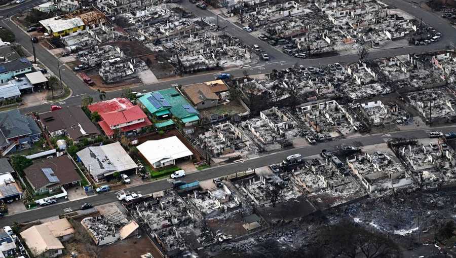 US-FIRE-HAWAII An aerial image taken on August 10, 2023 shows destroyed homes and buildings burned to the ground in Lahaina in the aftermath of wildfires in western Maui, Hawaii. At least 36 people have died after a fast-moving wildfire turned Lahaina to ashes, officials said August 9, 2023 as visitors asked to leave the island of Maui found themselves stranded at the airport. The fires began burning early August 8, scorching thousands of acres and putting homes, businesses and 35,000 lives at risk on Maui, the Hawaii Emergency Management Agency said in a statement. (Photo by Patrick T. Fallon / AFP) (Photo by PATRICK T. FALLON/AFP via Getty Images)