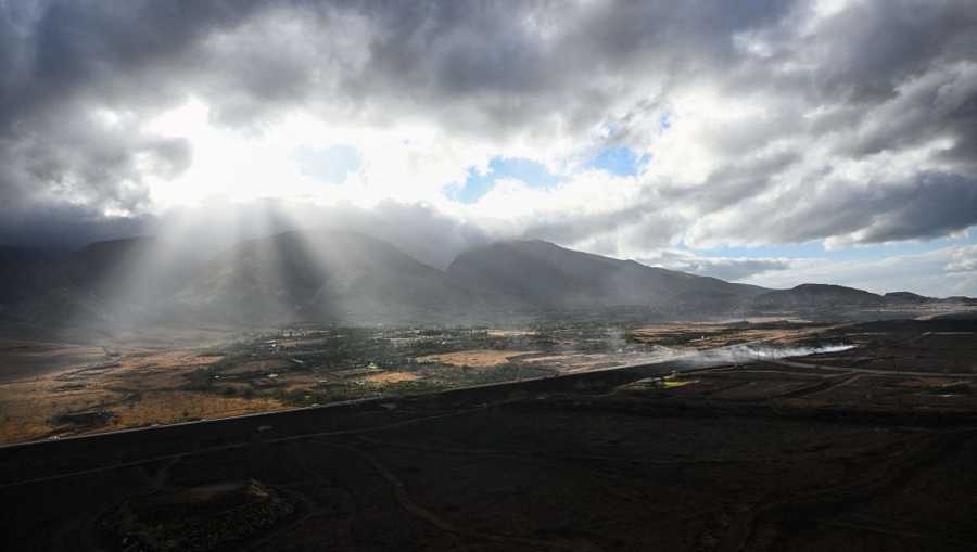 US-FIRE-HAWAII An aerial image shows a burned hillside above Lahaina in the aftermath of wildfires in western Maui in Lahaina, Hawaii, on August 10, 2023. At least 36 people have died after a fast-moving wildfire turned Lahaina to ashes, officials said August 9, 2023 as visitors asked to leave the island of Maui found themselves stranded at the airport. The fires began burning early August 8, scorching thousands of acres and putting homes, businesses and 35,000 lives at risk on Maui, the Hawaii Emergency Management Agency said in a statement. (Photo by Patrick T. Fallon / AFP) (Photo by PATRICK T. FALLON/AFP via Getty Images)