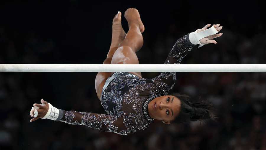 Artistic Gymnastics - Olympic Games Paris 2024: Day 2 PARIS, FRANCE - JULY 28: Simone Biles of Team USA competes on the uneven bars during the Women's Artistic Gymnastics Qualification on day two of the Olympic Games Paris 2024 at Bercy Arena on July 28, 2024 in Paris, France. (Photo by Naomi Baker/Getty Images)
