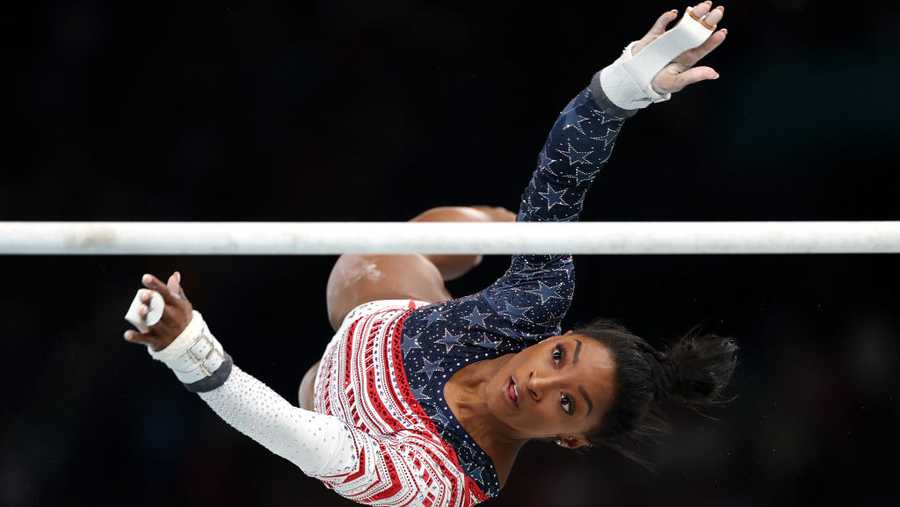 Artistic Gymnastics - Olympic Games Paris 2024: Day 4 PARIS, FRANCE - JULY 30: Simone Biles of Team United States in action on the uneven bars during the Artistic Gymnastics Women's Team Final on day four of the Olympic Games Paris 2024 at Bercy Arena on July 30, 2024 in Paris, France. (Photo by Jamie Squire/Getty Images)