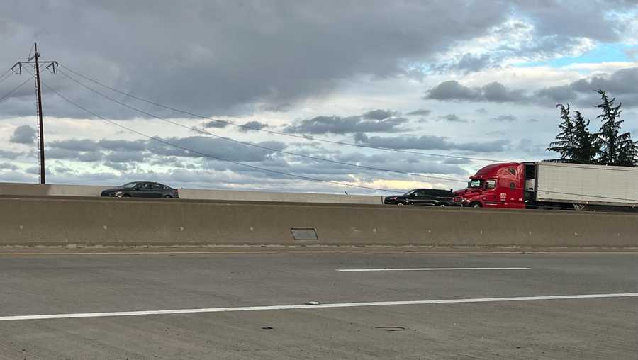 People drive under powerlines on Highway 65. People drive under powerlines on Highway 65.